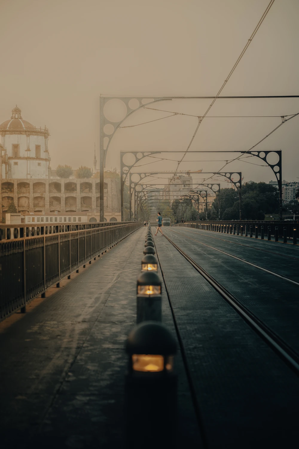Empty tram tracks in Porto at dusk, symmetrical urban perspective
